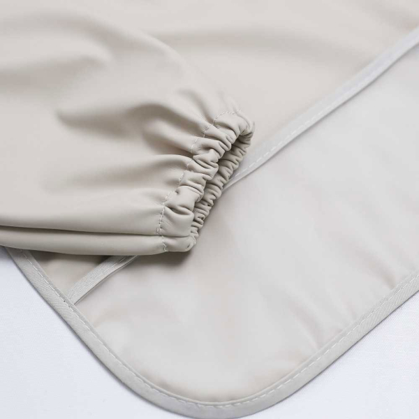 Σαλιάρα Με Μανίκια 6+ Μηνών (40x30) Trois Kilos Sept Εκρού 55-8085423